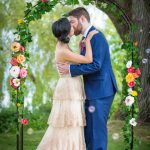 THE BROCKHOUSE VANCOUVER WEDDING FLORAL ARCH BHLDN ROSECLIFF GOWN SIMONS BLUE SUIT BUBBLES