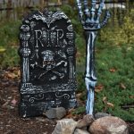 Halloween outdoor decor tombstone skeleton arm reaching out of the ground