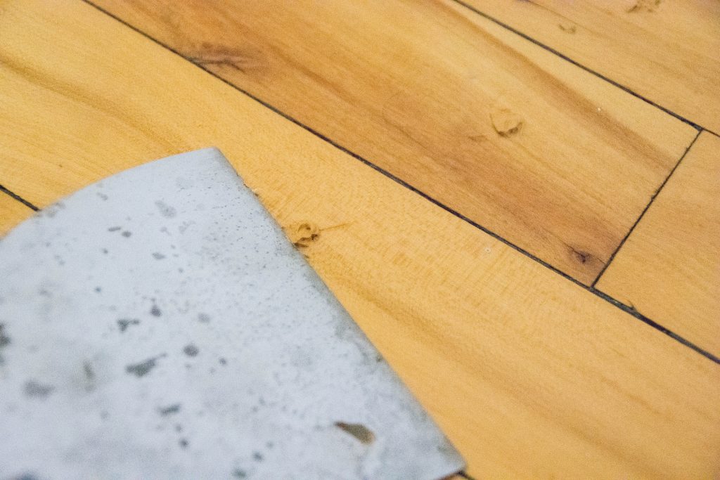 scrap off excess wood filler DIY fix squeaky floor Montreal lifestyle blog