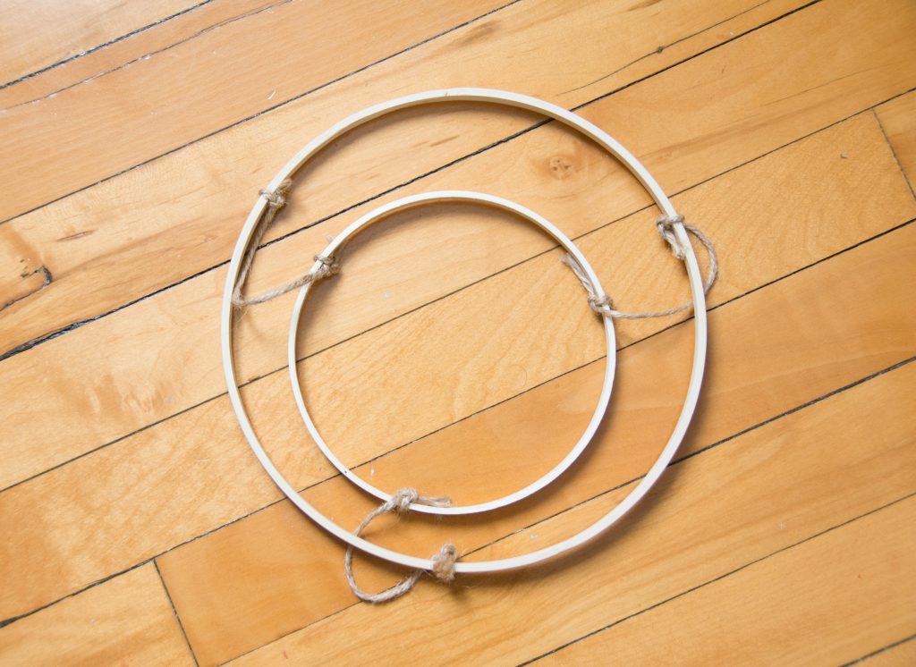 attach smaller hoop to larger hoop using twine DIY ribbon chandelier Montreal lifestyle blog